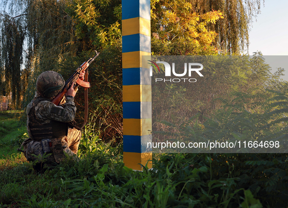 A serviceman of a mobile fire group of the State Border Guard Service of Ukraine aims a rifle while on a mission in Odesa region, Ukraine, o...