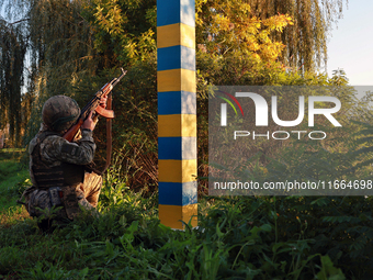 A serviceman of a mobile fire group of the State Border Guard Service of Ukraine aims a rifle while on a mission in Odesa region, Ukraine, o...