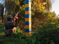 A serviceman of a mobile fire group of the State Border Guard Service of Ukraine aims a rifle while on a mission in Odesa region, Ukraine, o...