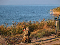 A serviceman of a mobile fire group of the State Border Guard Service of Ukraine aims a rifle while on a mission in Odesa region, Ukraine, o...