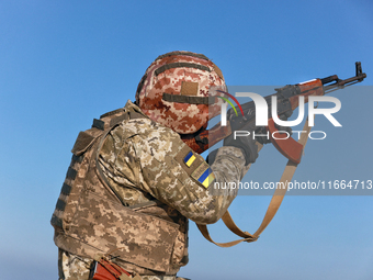 A serviceman of a mobile fire group of the State Border Guard Service of Ukraine aims a rifle while on a mission in Odesa region, Ukraine, o...