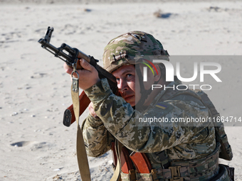 A serviceman of a mobile fire group of the State Border Guard Service of Ukraine aims a rifle while on a mission in Odesa region, Ukraine, o...