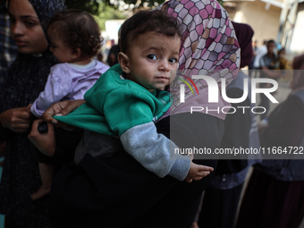 Palestinian children receive drops as part of a polio vaccination campaign in Deir al-Balah, Gaza Strip, on October 14, 2024, amid the ongoi...