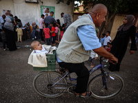 Palestinian children receive drops as part of a polio vaccination campaign in Deir al-Balah, Gaza Strip, on October 14, 2024, amid the ongoi...