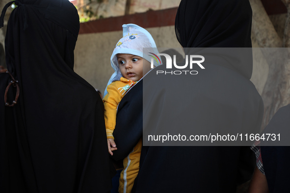 Palestinian children receive drops as part of a polio vaccination campaign in Deir al-Balah, Gaza Strip, on October 14, 2024, amid the ongoi...