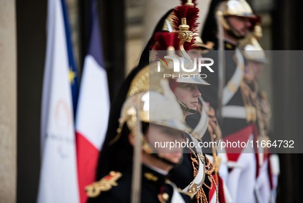 Presidential guards stand at the Elysee Palace during the visit of King Philippe and Queen Mathilde of the Belgians, who are welcomed by Pre...