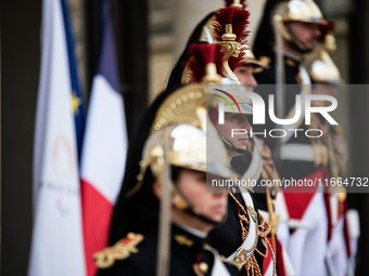 Presidential guards stand at the Elysee Palace during the visit of King Philippe and Queen Mathilde of the Belgians, who are welcomed by Pre...