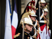 Presidential guards stand at the Elysee Palace during the visit of King Philippe and Queen Mathilde of the Belgians, who are welcomed by Pre...