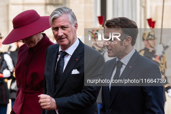 French President Emmanuel Macron and First Lady Brigitte receive King Philippe of the Belgians and Queen Mathilde at the Elysee Palace in Pa...