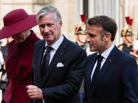 French President Emmanuel Macron and First Lady Brigitte receive King Philippe of the Belgians and Queen Mathilde at the Elysee Palace in Pa...