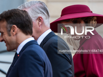 French President Emmanuel Macron and First Lady Brigitte receive King Philippe of the Belgians and Queen Mathilde at the Elysee Palace in Pa...