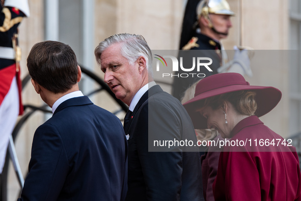 French President Emmanuel Macron and First Lady Brigitte receive King Philippe of the Belgians and Queen Mathilde at the Elysee Palace in Pa...