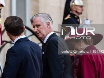 French President Emmanuel Macron and First Lady Brigitte receive King Philippe of the Belgians and Queen Mathilde at the Elysee Palace in Pa...