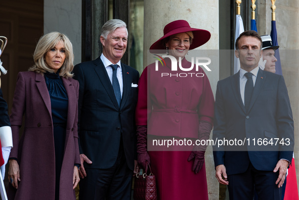 French President Emmanuel Macron and First Lady Brigitte receive King Philippe of the Belgians and Queen Mathilde at the Elysee Palace in Pa...