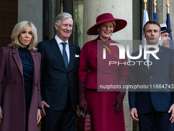 French President Emmanuel Macron and First Lady Brigitte receive King Philippe of the Belgians and Queen Mathilde at the Elysee Palace in Pa...