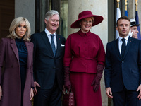 French President Emmanuel Macron and First Lady Brigitte receive King Philippe of the Belgians and Queen Mathilde at the Elysee Palace in Pa...