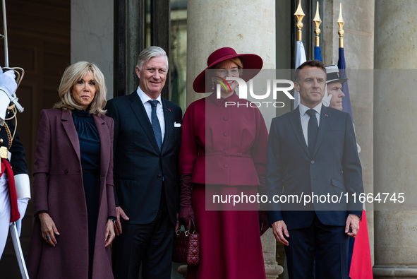 French President Emmanuel Macron and First Lady Brigitte receive King Philippe of the Belgians and Queen Mathilde at the Elysee Palace in Pa...