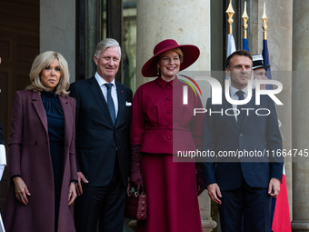 French President Emmanuel Macron and First Lady Brigitte receive King Philippe of the Belgians and Queen Mathilde at the Elysee Palace in Pa...