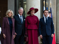 French President Emmanuel Macron and First Lady Brigitte receive King Philippe of the Belgians and Queen Mathilde at the Elysee Palace in Pa...