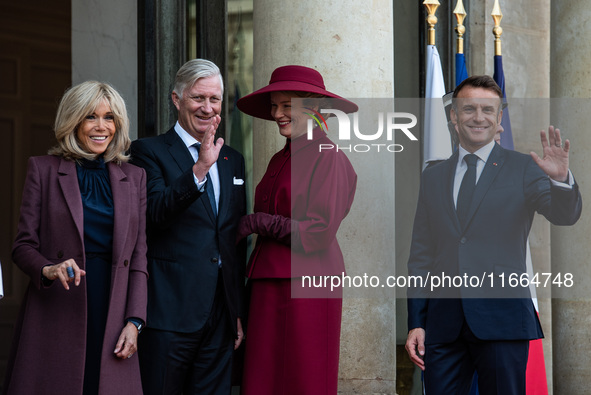 French President Emmanuel Macron and First Lady Brigitte receive King Philippe of the Belgians and Queen Mathilde at the Elysee Palace in Pa...