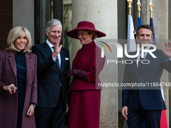 French President Emmanuel Macron and First Lady Brigitte receive King Philippe of the Belgians and Queen Mathilde at the Elysee Palace in Pa...