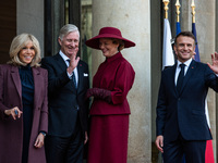 French President Emmanuel Macron and First Lady Brigitte receive King Philippe of the Belgians and Queen Mathilde at the Elysee Palace in Pa...