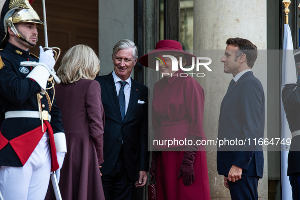 French President Emmanuel Macron and First Lady Brigitte receive King Philippe of the Belgians and Queen Mathilde at the Elysee Palace in Pa...