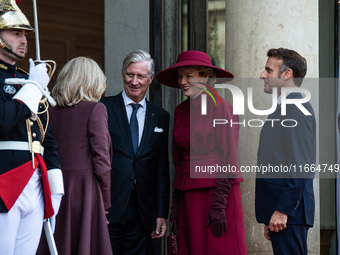 French President Emmanuel Macron and First Lady Brigitte receive King Philippe of the Belgians and Queen Mathilde at the Elysee Palace in Pa...