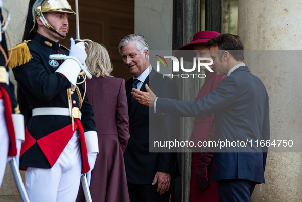 French President Emmanuel Macron and First Lady Brigitte receive King Philippe of the Belgians and Queen Mathilde at the Elysee Palace in Pa...