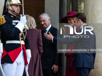 French President Emmanuel Macron and First Lady Brigitte receive King Philippe of the Belgians and Queen Mathilde at the Elysee Palace in Pa...