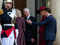 French President Emmanuel Macron and First Lady Brigitte receive King Philippe of the Belgians and Queen Mathilde at the Elysee Palace in Pa...