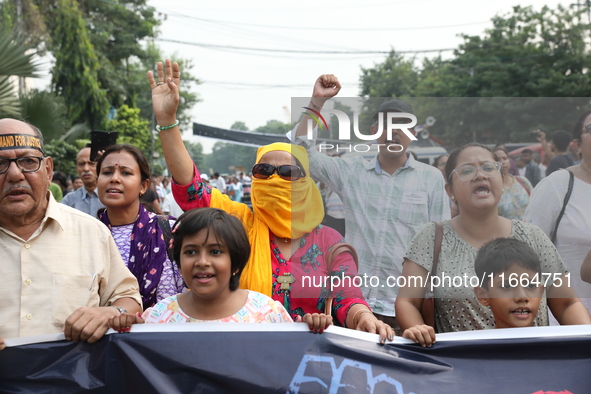 Doctors and citizens shout slogans during a protest march demanding that India's West Bengal state government provide better security measur...