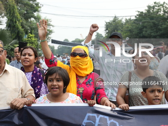 Doctors and citizens shout slogans during a protest march demanding that India's West Bengal state government provide better security measur...