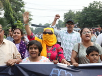 Doctors and citizens shout slogans during a protest march demanding that India's West Bengal state government provide better security measur...