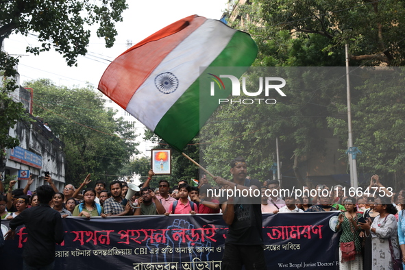 Doctors and citizens shout slogans during a protest march demanding that India's West Bengal state government provide better security measur...