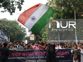 Doctors and citizens shout slogans during a protest march demanding that India's West Bengal state government provide better security measur...