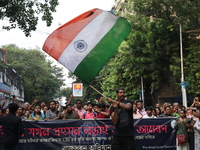 Doctors and citizens shout slogans during a protest march demanding that India's West Bengal state government provide better security measur...