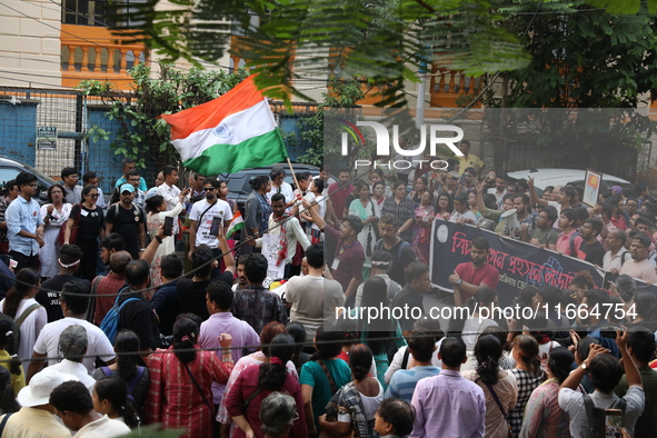 Doctors and citizens shout slogans during a protest march demanding that India's West Bengal state government provide better security measur...