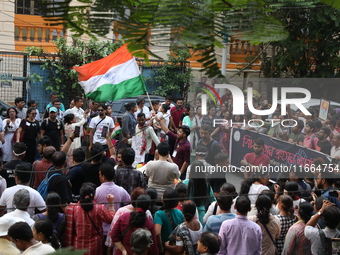 Doctors and citizens shout slogans during a protest march demanding that India's West Bengal state government provide better security measur...