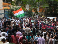 Doctors and citizens shout slogans during a protest march demanding that India's West Bengal state government provide better security measur...