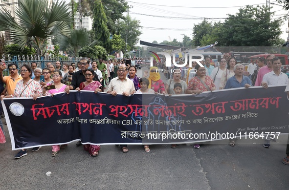 Doctors and citizens shout slogans during a protest march demanding that India's West Bengal state government provide better security measur...