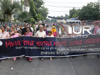 Doctors and citizens shout slogans during a protest march demanding that India's West Bengal state government provide better security measur...