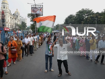 Doctors and citizens shout slogans during a protest march demanding that India's West Bengal state government provide better security measur...