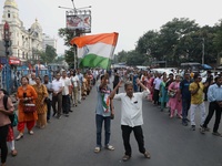 Doctors and citizens shout slogans during a protest march demanding that India's West Bengal state government provide better security measur...