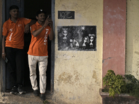 A Swiggy delivery person takes a mobile photograph at an event in Mumbai, India, on October 14, 2024. IPO-bound Swiggy launches an XL fleet...