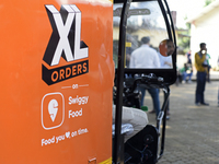 XL Swiggy branding is seen during a promotional event in Mumbai, India, on October 14, 2024. IPO-bound Swiggy launches an XL fleet to cater...