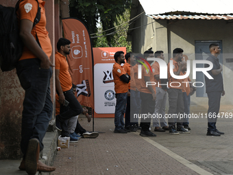 Swiggy gig workers stand during a promotional event in Mumbai, India, on October 14, 2024. IPO-bound Swiggy launches an XL fleet to cater to...