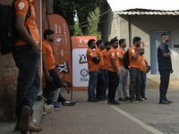 Swiggy gig workers stand during a promotional event in Mumbai, India, on October 14, 2024. IPO-bound Swiggy launches an XL fleet to cater to...