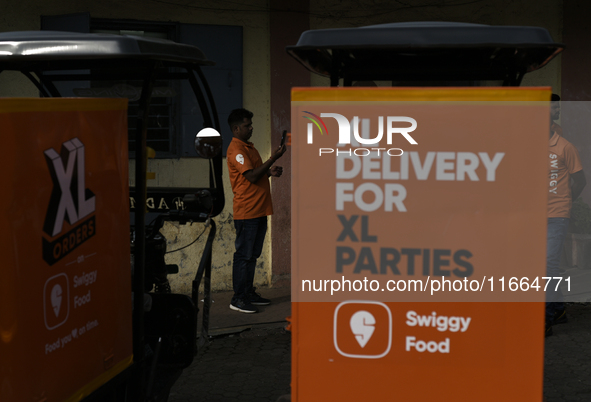 A Swiggy gig worker is seen during a promotional event in Mumbai, India, on October 14, 2024. IPO-bound Swiggy launches an XL fleet to cater...