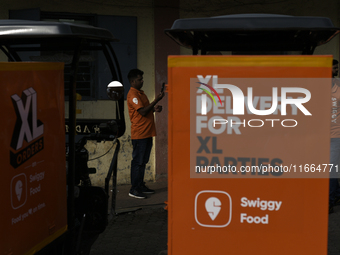 A Swiggy gig worker is seen during a promotional event in Mumbai, India, on October 14, 2024. IPO-bound Swiggy launches an XL fleet to cater...